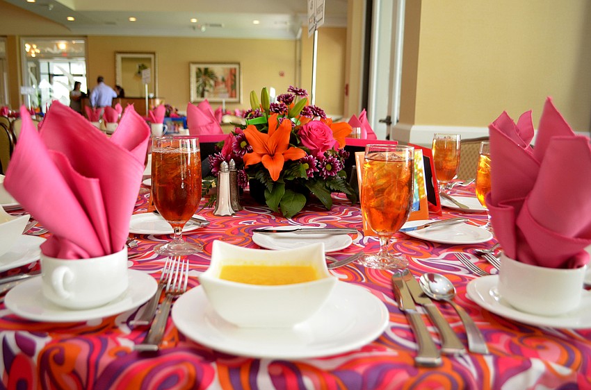 The table clothes matched the groovy theme while pictures of member and their guests circled each table.