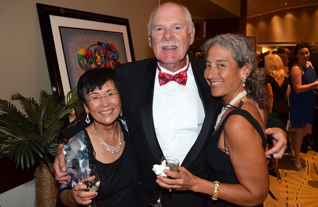 Doc Wallace (pictured with Masako Carlson and Haunani Wallace) found his custom cat bowtie on Etsy.com, which he wore proudly to Cat Depot&#39;        s Stop in the Name of Love Gala on March 11 at Hyatt Regency Sarasota.