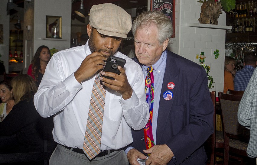 Edward James III and Patrick Gannon check preliminary results.
