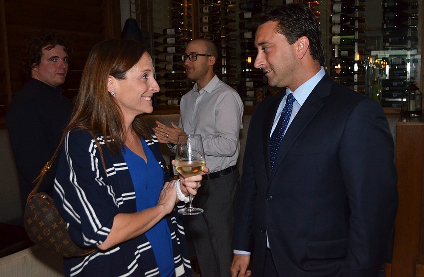 Margaret Good smiles at Hagen Brody after telling her that he is currently in second place.