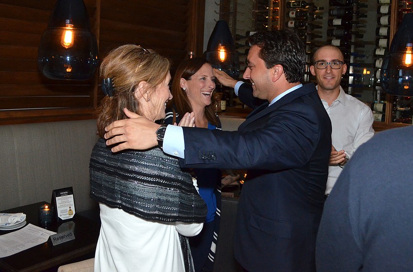 Hagen Brody hugs Tere Fleming and Margaret Good after hearing the final results.
