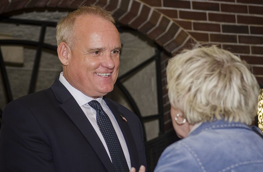 Martin Hyde speaks with supporters who gathered at Caragiulos to await election results.