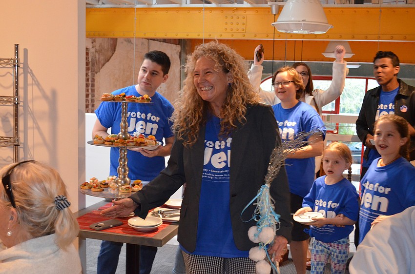 Jen Ahearn-Koch reacts to the results from Tuesday'  s election. Ahearn-Koch was the top vote-getter in the City Commission race.