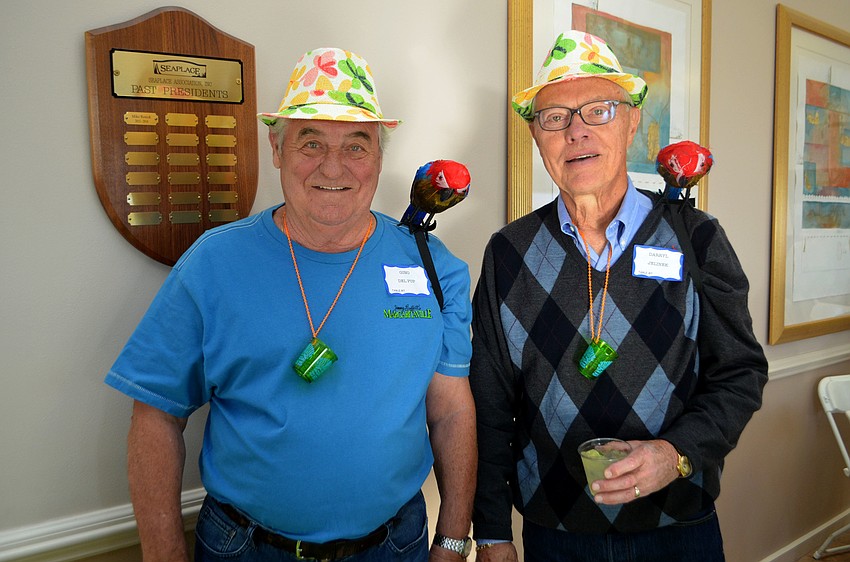 Gino Del Pup and Darryl Jelinek manned the margarita table with the help of some parrots.