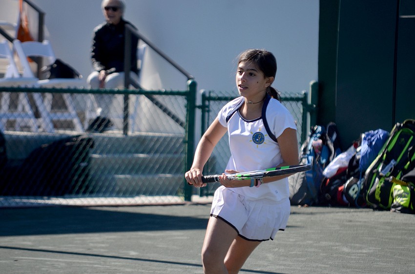 Nitzan, 12, anticipates a serve from coach Noam Yitzhaki