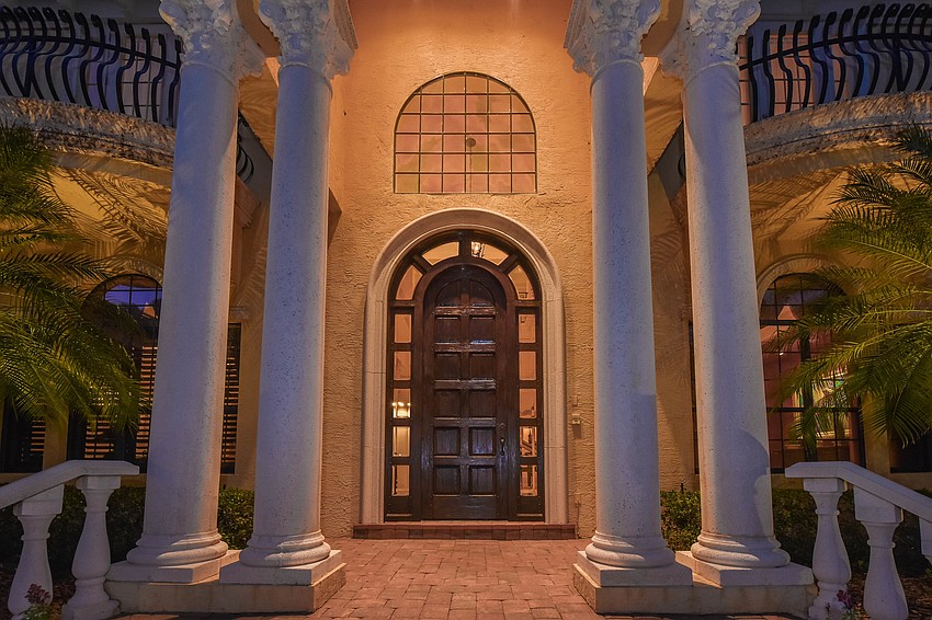 The amazing solid, wood door greets everyone at the front doorl