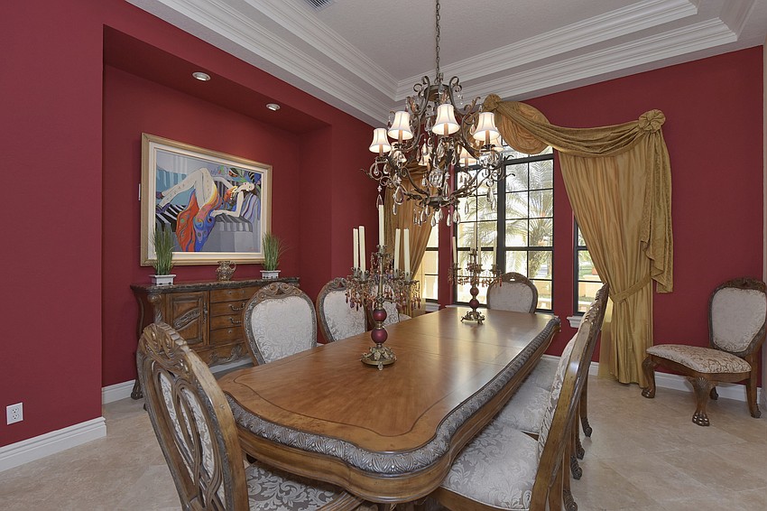 Bring binoculars to this dinner room table if you want to see the person on the opposite end.