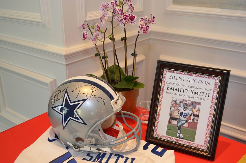 Guests had the chance to bid on the sole — yet noteworthy — silent auction item, a football helmet and jersey autographed by Dallas Cowboys Running Back Emmitt Smith, at Glitz at the Ritz on March 16 at The Ritz-Carlton, Sarasota.