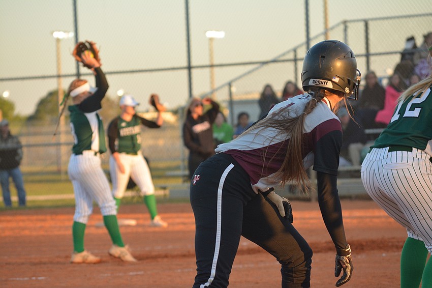 Braden River'  s Ali Yawn stares at Lakewood Ranch pitcher Kailey Christian from third base.