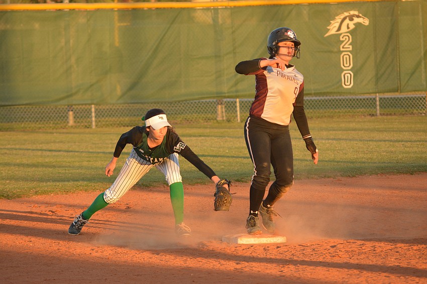 Lakewood Ranch'  s Denali Schappacher applies a tag to Braden River'  s Myah Moy, but Moy slid in safely.