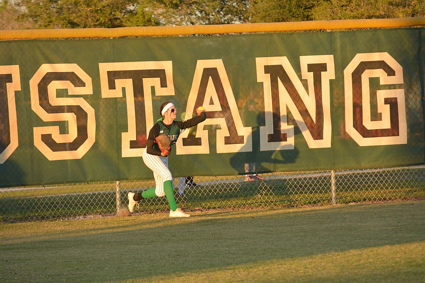 Lakewood Ranch'  s Avery Goelz tosses a ball back to the infield.
