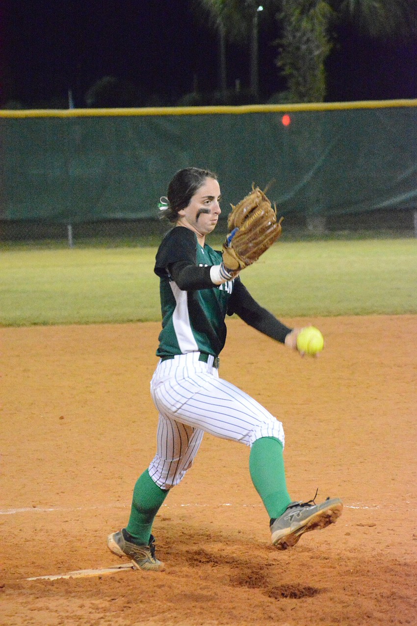 The Mustangs'   Logan Newton fires a pitch to the plate.