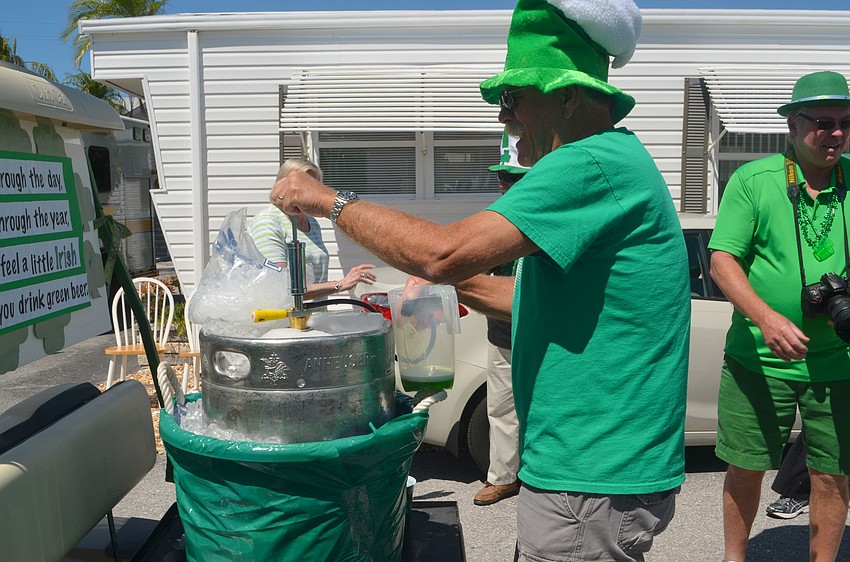 Steve Bolton pours green beers for the crowd.