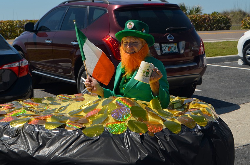Kay Heigle dressed as a leprechaun with a pot of gold.