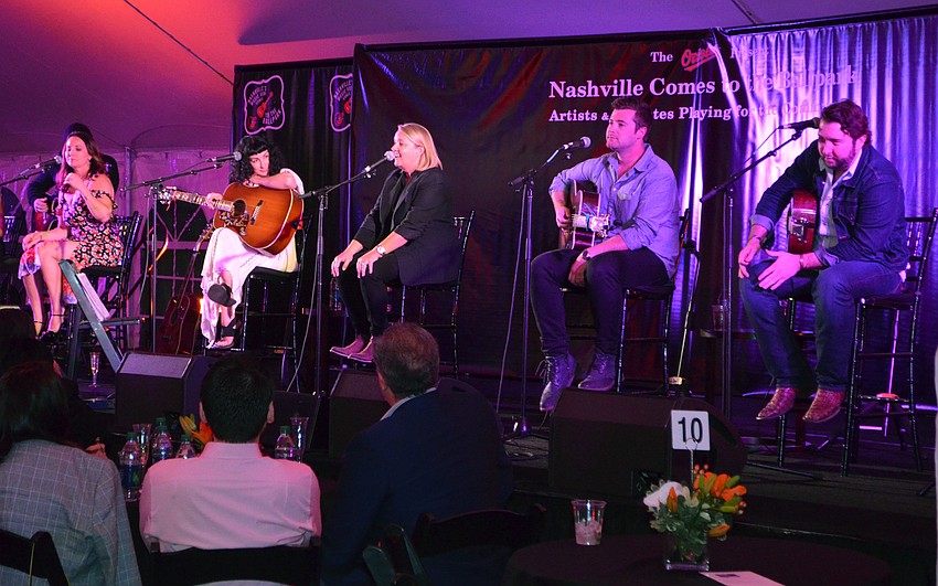 Liz Rose performs “White Horse,” which she co-wrote with Taylor Swift, at Nashville' s Music Row Comes to the Ballpark on March 17 at Ed Smith Stadium.