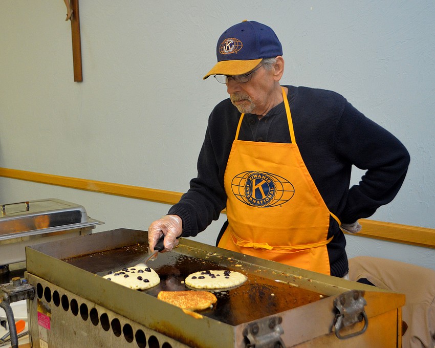 Jim Krenik cooks blueberry pancakes. Him and Richard March are known as the veteran pancake makers for the annual breakfast.