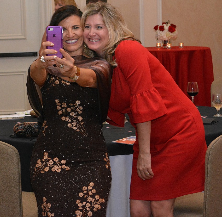 Keiser University'  s Viloleta Huesman grabs a selfie with Lakewood Ranch Business Alliance Executive Director Heather Kasten.