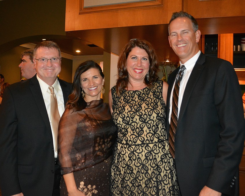 Mark Huesman, Violeta Huesman, Denise Pope and Robert Pope are regular supporters of the Lakewood Ranch Community Fund.