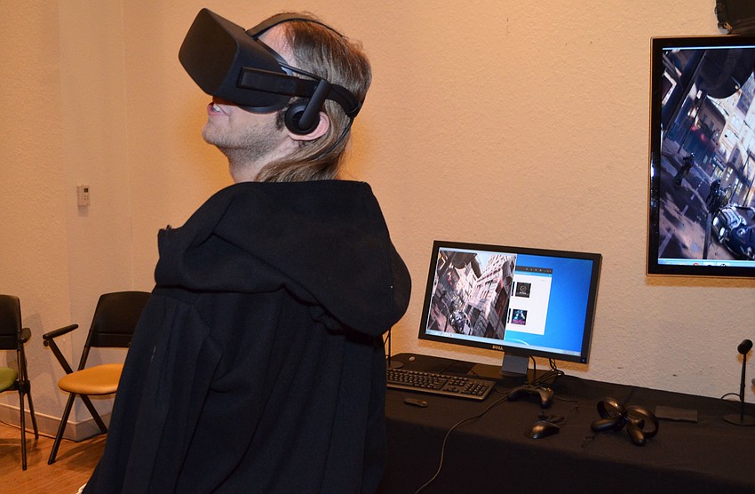 Student scholarship winner Nathan Clark tries a virtual reality simulation at An Evening at the Avant-Garde on March 18 at Ringling College of Art and Design.