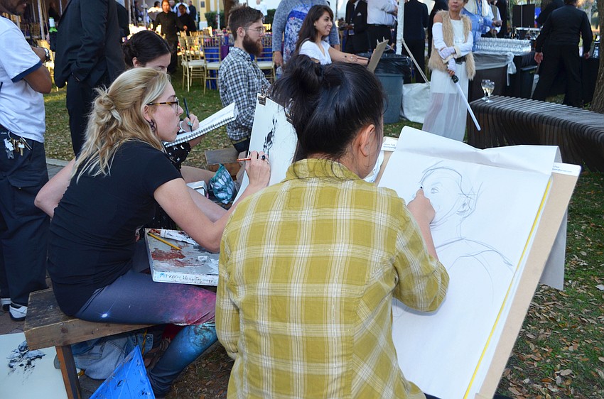 Ringling College of Art and Design students Darcy Kelly Laviolette and Dasom Park do a live sketches at An Evening at the Avant-Garde on March 18 at Ringling College of Art and Design.