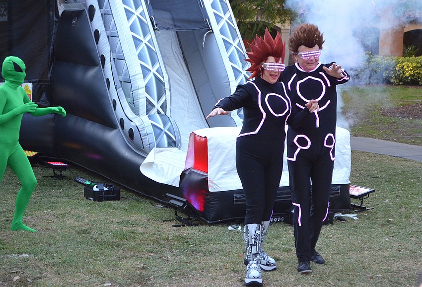 Pat and Larry Thompson make their grand entrance at An Evening at the Avant-Garde on March 18 at Ringling College of Art and Design.