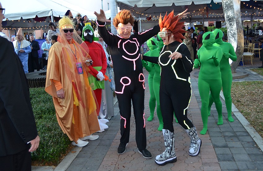 Pat and Larry Thompson make their grand entrance at An Evening at the Avant-Garde on March 18 at Ringling College of Art and Design.