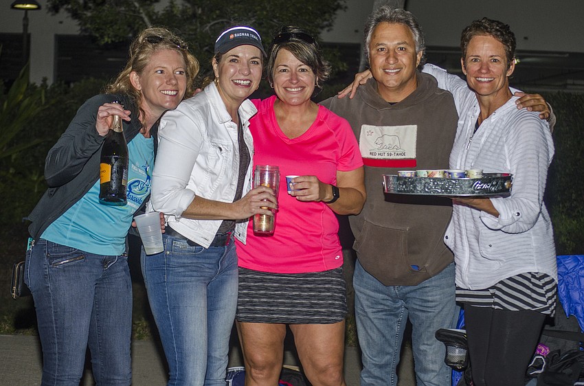 Rebeca Lerant, Elaine Alexander, Brenda Smith, Marvin Bendinsky and Jennifer Castle passed out shots of Fireball Cinnamon Whisky to runners of the First Watch Sarasota Half Marathon.