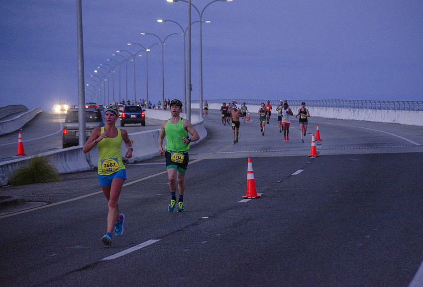 Runners cross the Ringling Bridge during the First Watch Sarasota Half Marathon.