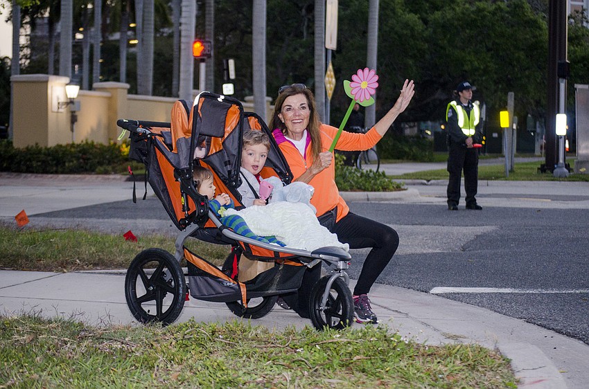 Henry, Graham and Beth Steward cheer on runners.
