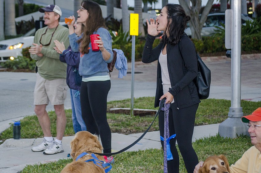 Phil and Cindy Henninge, Becca Chamberlain and Soraya Preseault cheer on runners of the First Watch Sarasota Half Marathon.