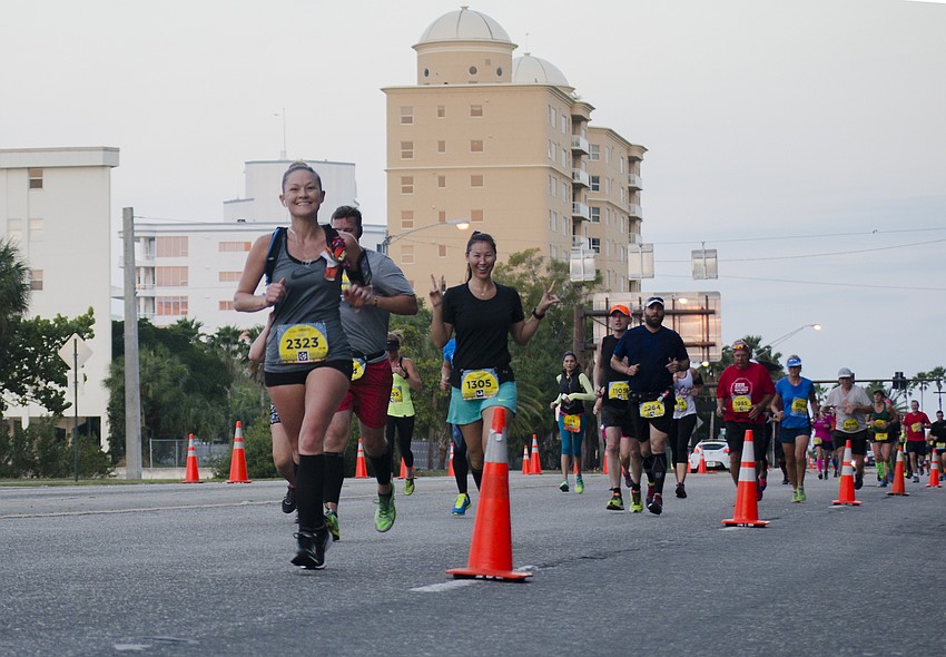 Runners run in the First Watch Sarasota Half Marathon.