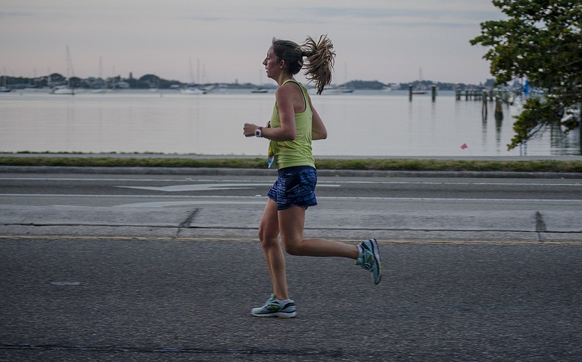 Runners run in the First Watch Sarasota Half Marathon.