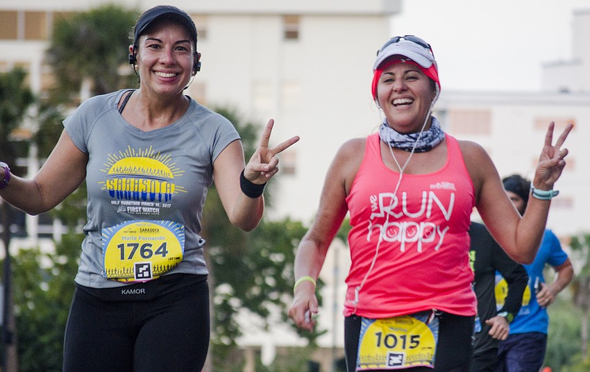 Runners run in the First Watch Sarasota Half Marathon.
