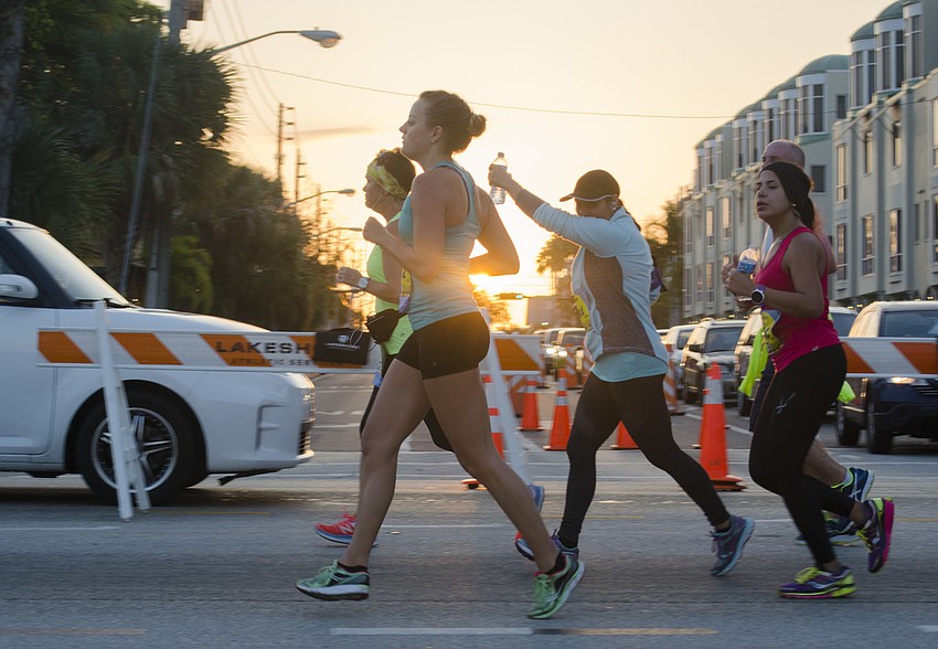 Runners run in the First Watch Sarasota Half Marathon.
