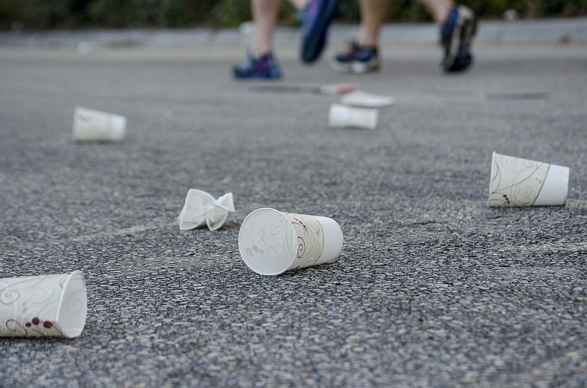 Empty cups littered Fruitville Road near the half way point of the First Watch Sarasota Half Marathon.