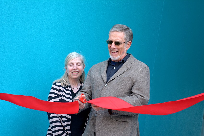 Paul and Sharon Steinwachs cut the ribbon.
