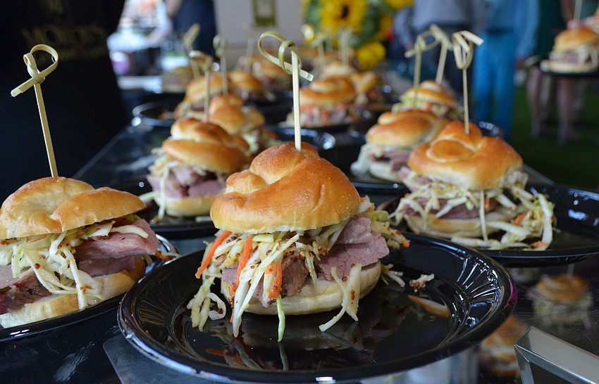 Staff members from Morton’s Gourmet Market served house-smoked pastrami sliders at the Celebrity Chefs Food & Wine Tasting on March 21 at the Resort at Longboat Key Club.