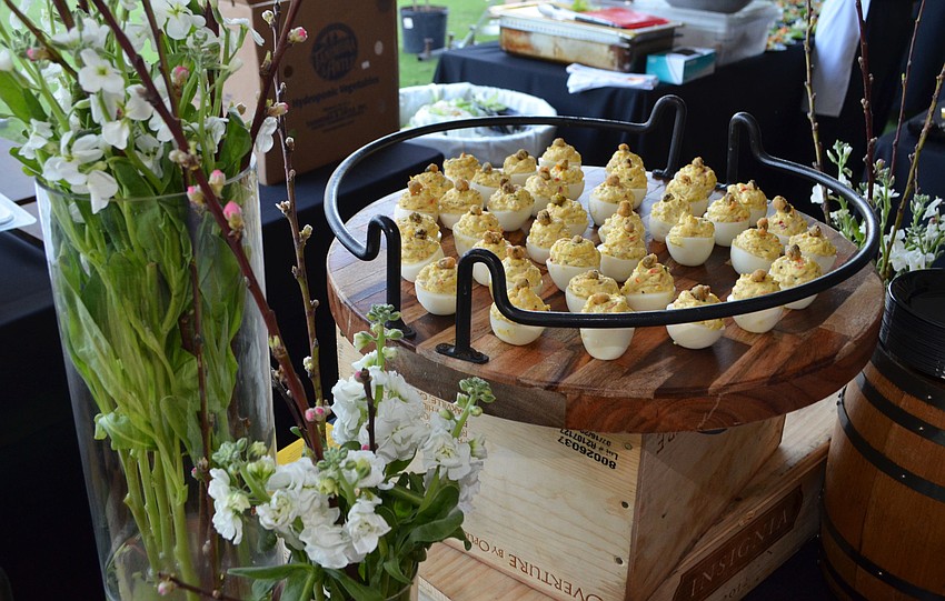 Staff members from Louie’s Modern served smoked trout deviled eggs at the Celebrity Chefs Food & Wine Tasting on March 21 at the Resort at Longboat Key Club.