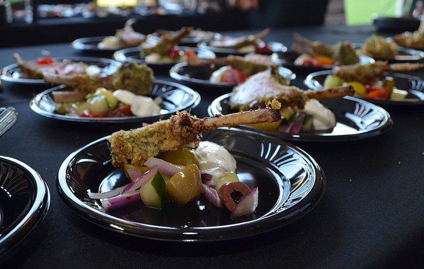 Staff members from Apollonia served rack of lamb at the Celebrity Chefs Food & Wine Tasting on March 21 at the Resort at Longboat Key Club.