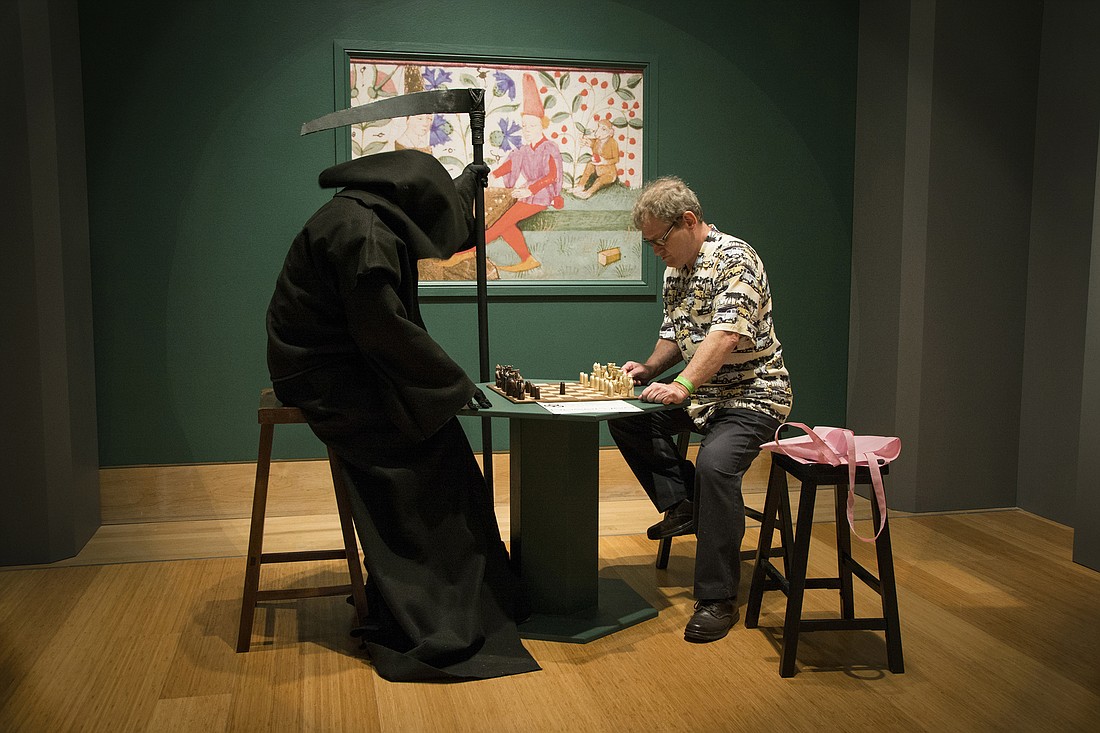Marty Fugate and The Grim Reaper enjoy a game of chess. Photo by Ellie Bloom.
