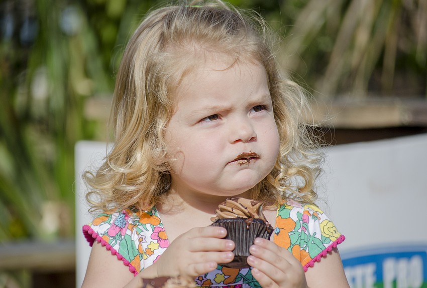 Violet Cooper enjoys a cupcake.