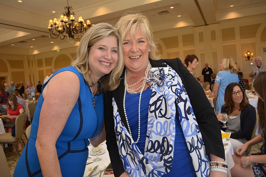 Panther Ridge'  s Heather Kasten, whose daughter has cystic fibrosis, sits for lunch with friend Maribeth Phillips.