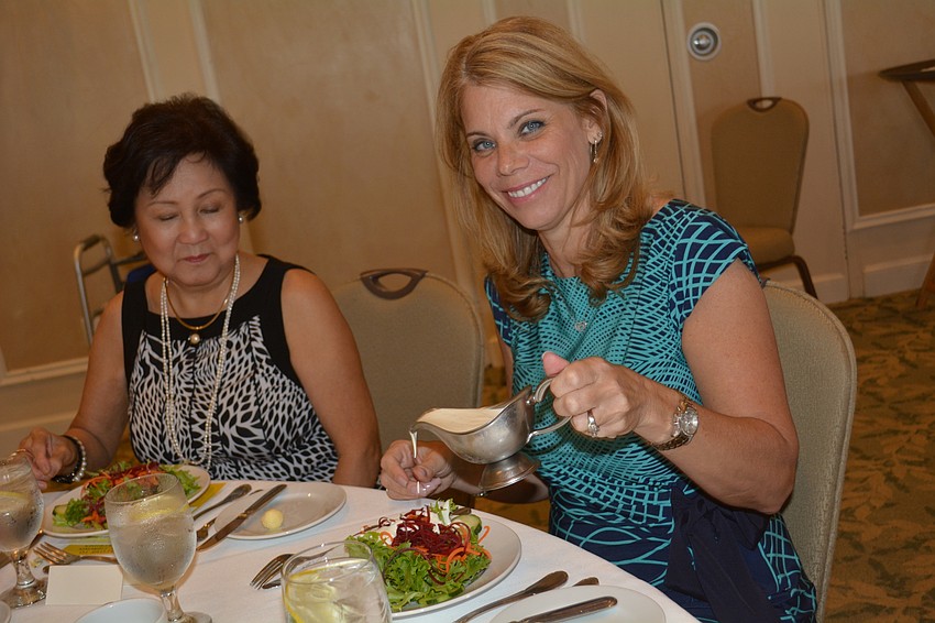 East County'  s Helaine Giddens digs into the salad portion of the meal.
