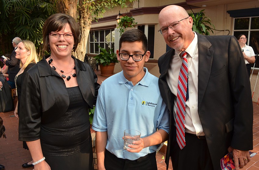 Lighthouse of Manasota CEO Lisa Howard, Jesus Herrera and Peter Howard