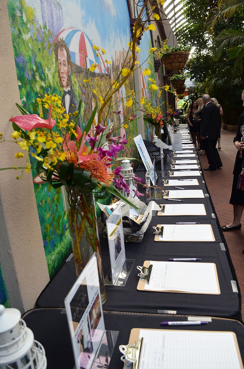 Auction items included several rounds of golf at local courses, wine baskets, spa packages, jewelry and much more at the second annual Art in the Dark on March 24 at Michael’s On East.