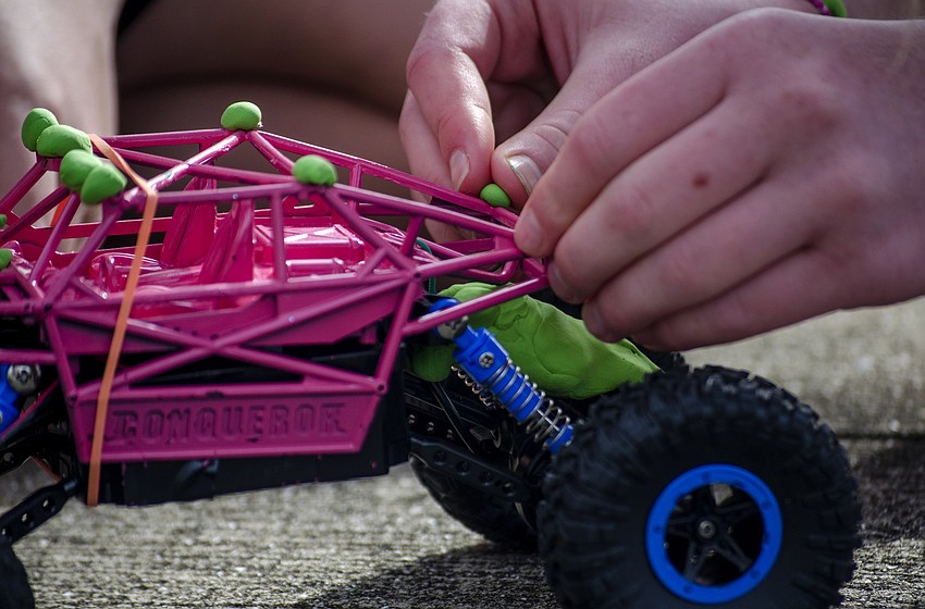 Sarasota Pflug makes some last minute additions to her teams entry in the RC Car Open.