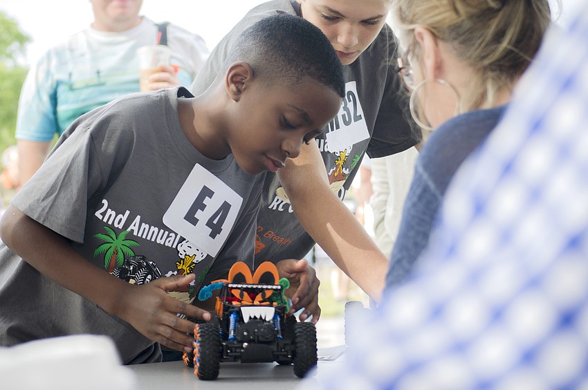 Jalen Lowe submits his car to be judged at the RC Car Open.