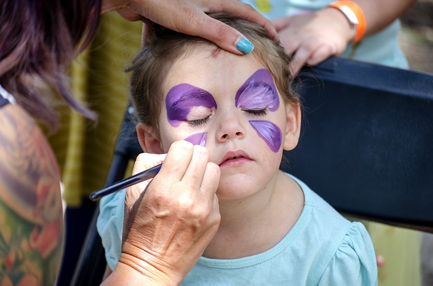 Ariana Dasaro gets her face painted.