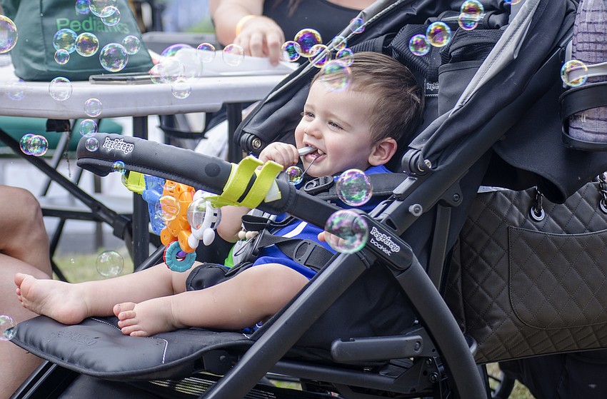 Landon Walsh-Middleton laughs at bubbles.
