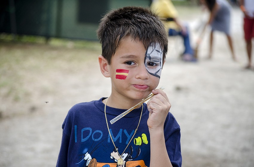 Fabrizio Huirse enjoys honey during the Honey Bee Festival